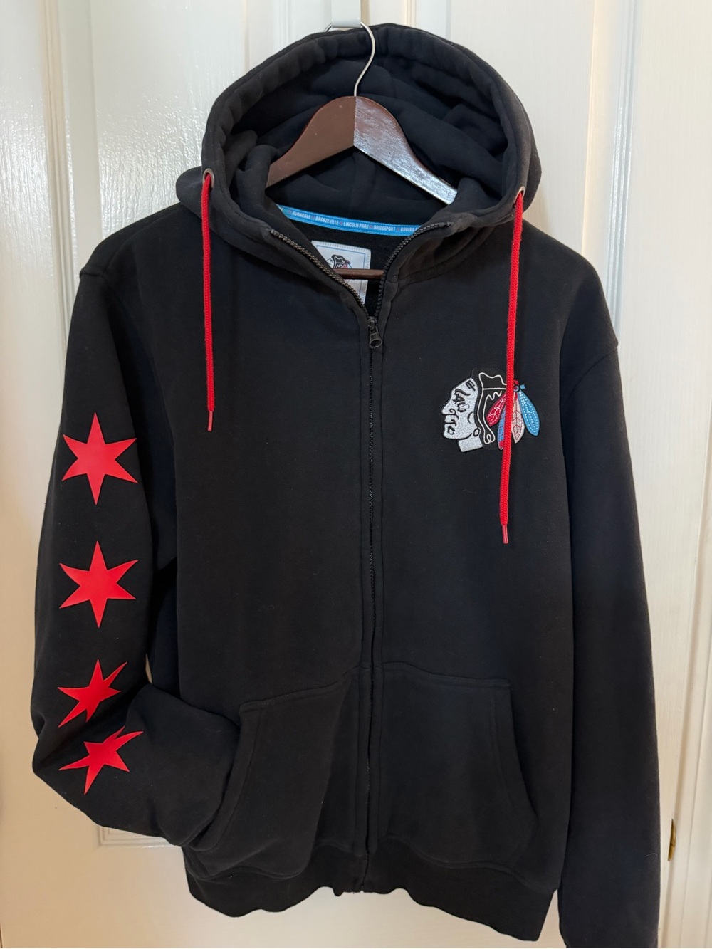 Black Zip-Up Hoodie with Red Star Sleeve Accents